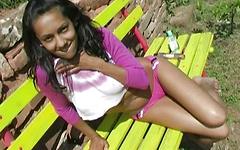 Hot Latina nineteen year old plays with her tight twat out on a park bench join background