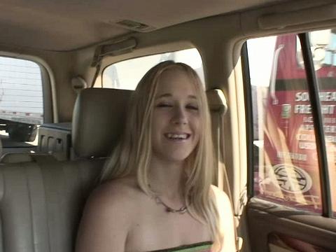A Nice Looking Blonde Masturbates In The Car With A Hard Purple Dildo