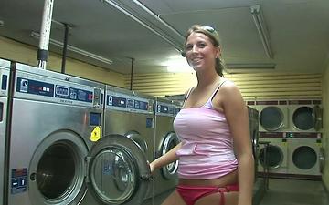 Download This big boobed slut discovers the fun of flashing at the laundromat