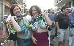 Some mature ladies on the street are showing their tits to get beads - movie 5 - 6