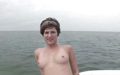 Doing a sexy striptease on the boat is capped with some big natural tits - movie 2 - 2