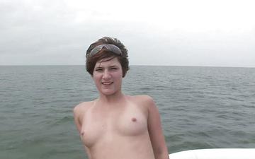 Herunterladen Doing a sexy striptease on the boat is capped with some big natural tits