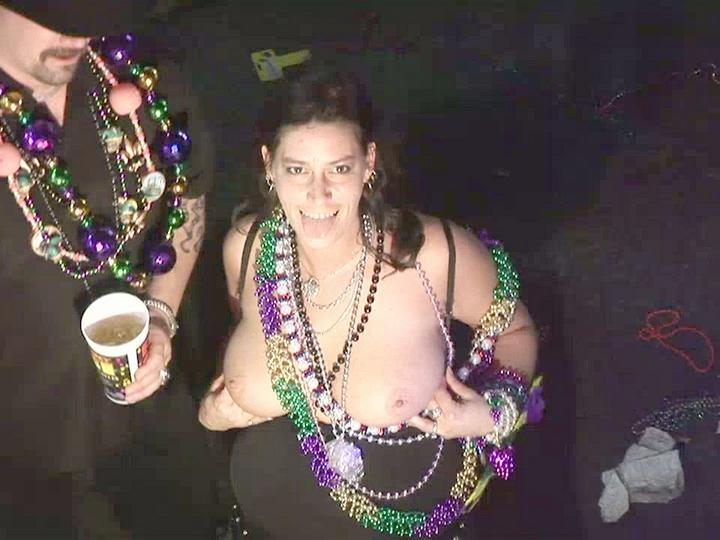 Christine Wears Many Beads And Rubs Her Breasts