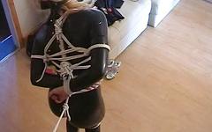 Blonde in black latex has her tits hanging out as she is bound in rope - movie 1 - 5