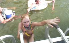 Lizzie starts to strip in front of everyone on the boat join background