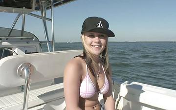 Herunterladen Hot college party girls flash their tits and do striptease outdoors on boat