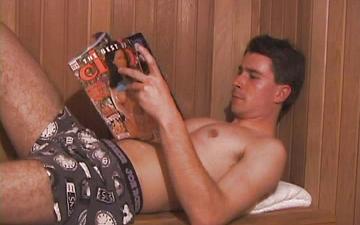 Download Handsome jock strokes his cock in sauna while looking at girlie magazine
