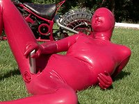 Watch Now - Encased head to toe kinky sandy k masturbates outdoors in fetish indulgence