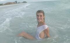 Sexy blonde amateur frolics in the surf and shows off her slender body join background
