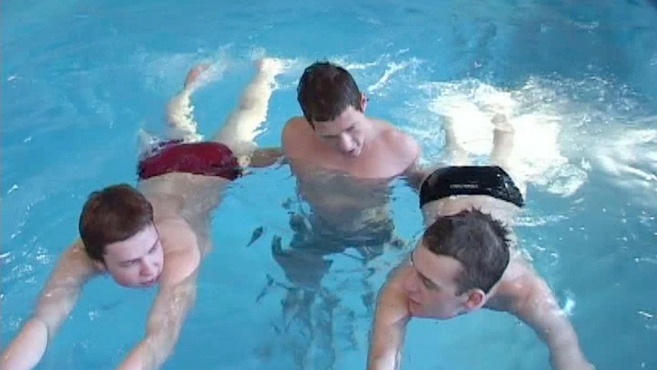 Hung twinks and jock have a bareback threesome at a swimming pool