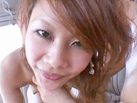 Watch Now - Japanese red head gives pov head in the back of a car