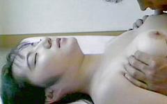 An Asian girl with short hair gets laid on the bed and takes a facial - movie 5 - 3