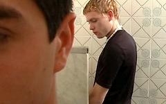 Athletic European twinks swap blowjobs in a public restroom join background