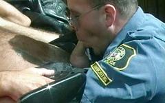 Hot cop in uniform gives a blowjob to a perp as he sits on a motorcycle - movie 1 - 7