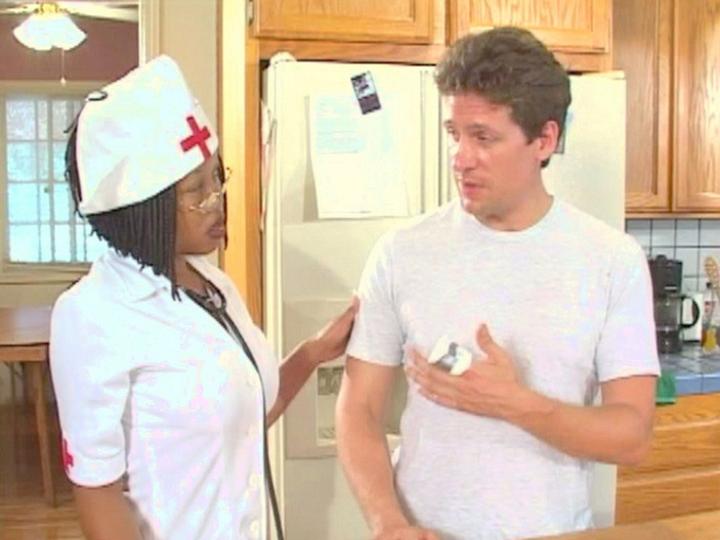Bespectacled ebony nurse takes care of patients with fucking.