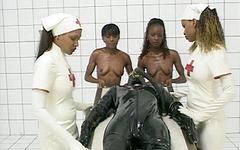 Watch Now - Interracial latex gangbang with black latex nurses and a white gimp dick.