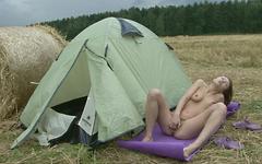 Slutty whore rubs her hairy pussy outside next to her tent. - movie 5 - 3