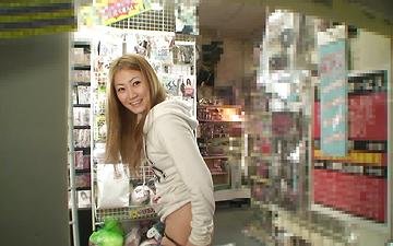 Download Asian hottie does a strip tease and gets off in a public store