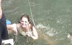Watch Now - Horny brunette jumps in the water