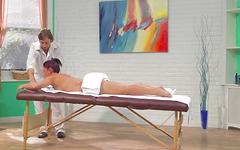 Mischa Brooks grips the massage table as he slips it in - movie 1 - 2