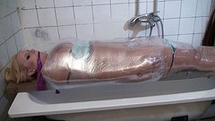 Angel Wicky is fully wrapped in plastic wrap which is filled with water - movie 3 - 2