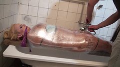 Watch Now - Angel wicky is fully wrapped in plastic wrap which is filled with water