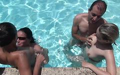 Swingers partner swap all around the pool at a resort in spain join background