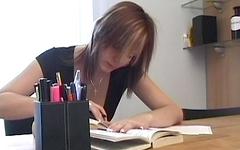 A great looking teen girl is bored so she masturbates right at the desk - movie 1 - 2