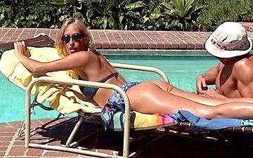 Download Oiled up for an afternoon of sun bathing this blonde gets drilled hard